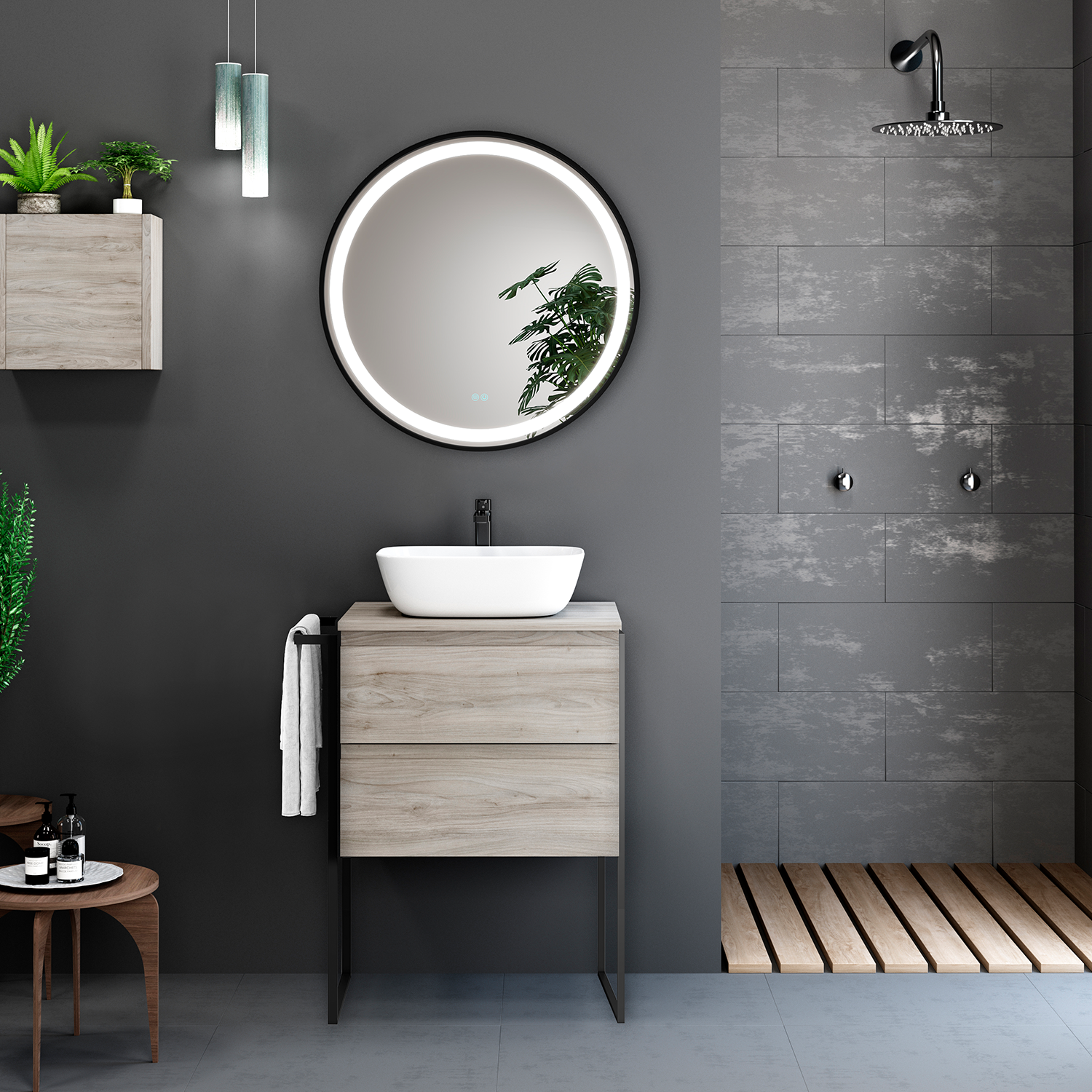 Bathroom with wooden vanity, round mirror, and gray tiled wall.