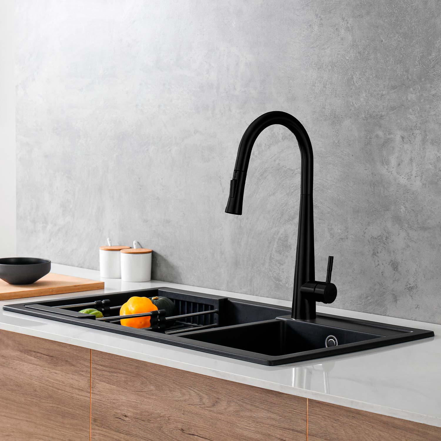 Black kitchen sink with faucet in a modern kitchen setting