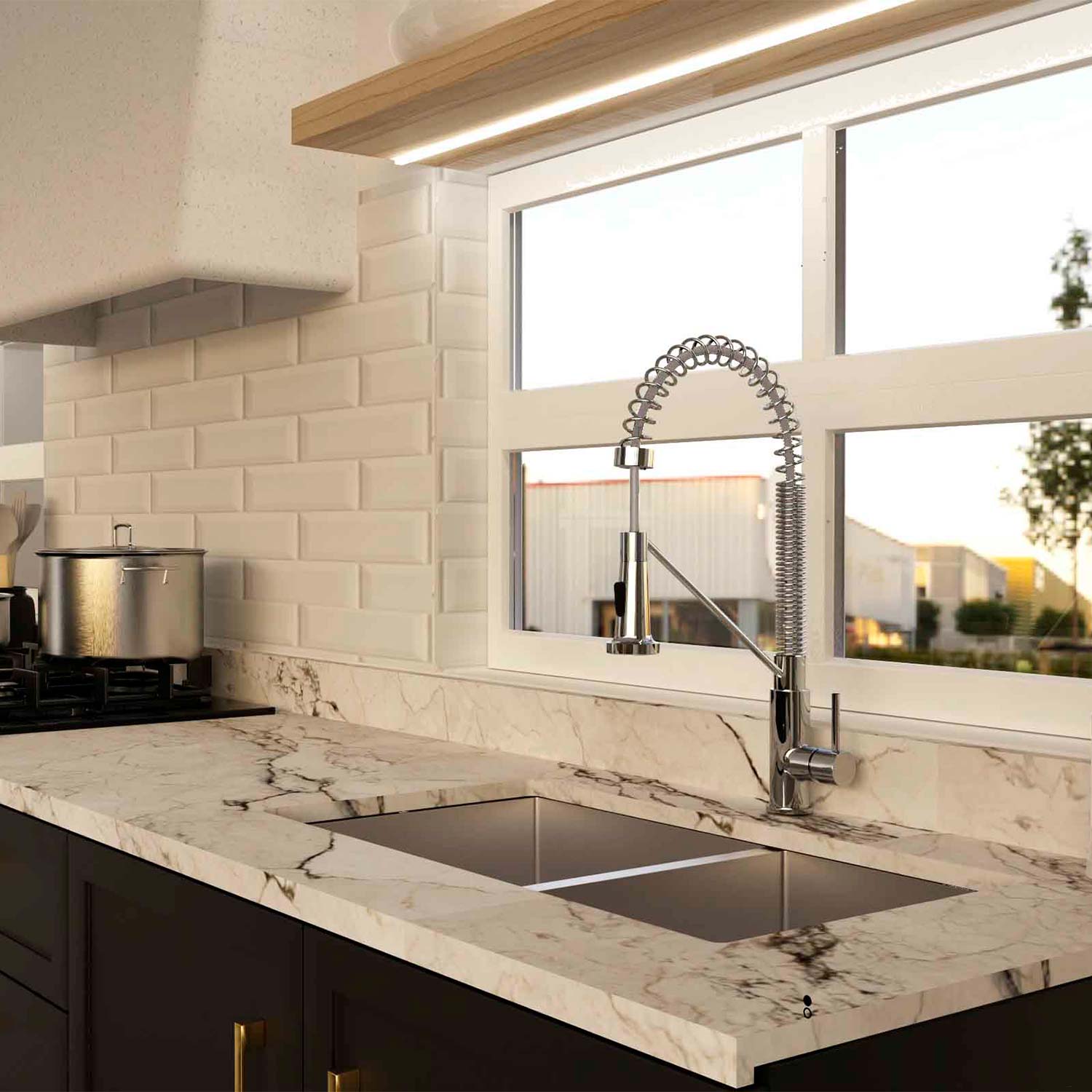 Modern kitchen with marble countertop, sink, and stainless steel faucet.