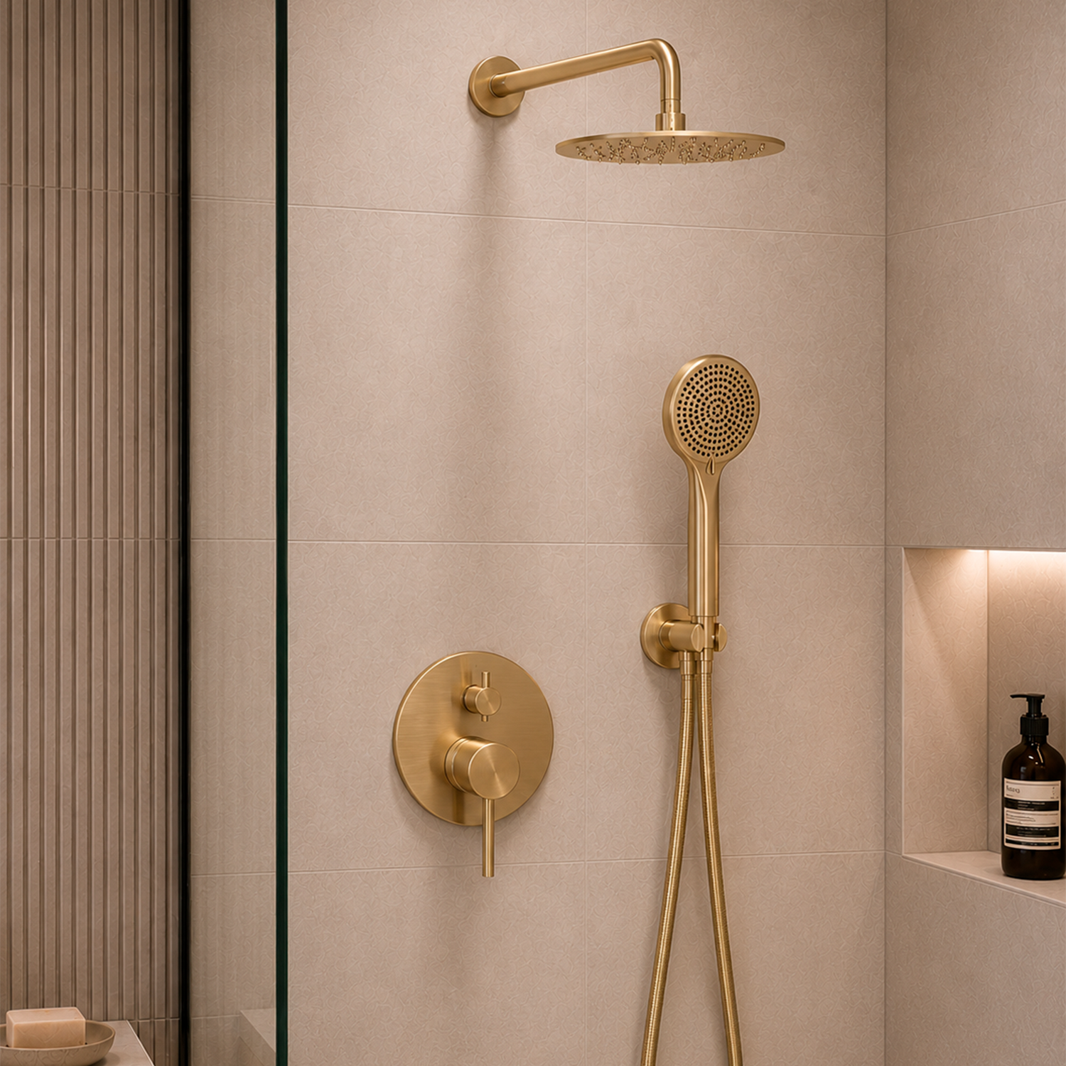 A modern shower system with a round overhead rain shower head, handheld shower wand, and round control valve on a beige tiled wall in a bathroom setting.