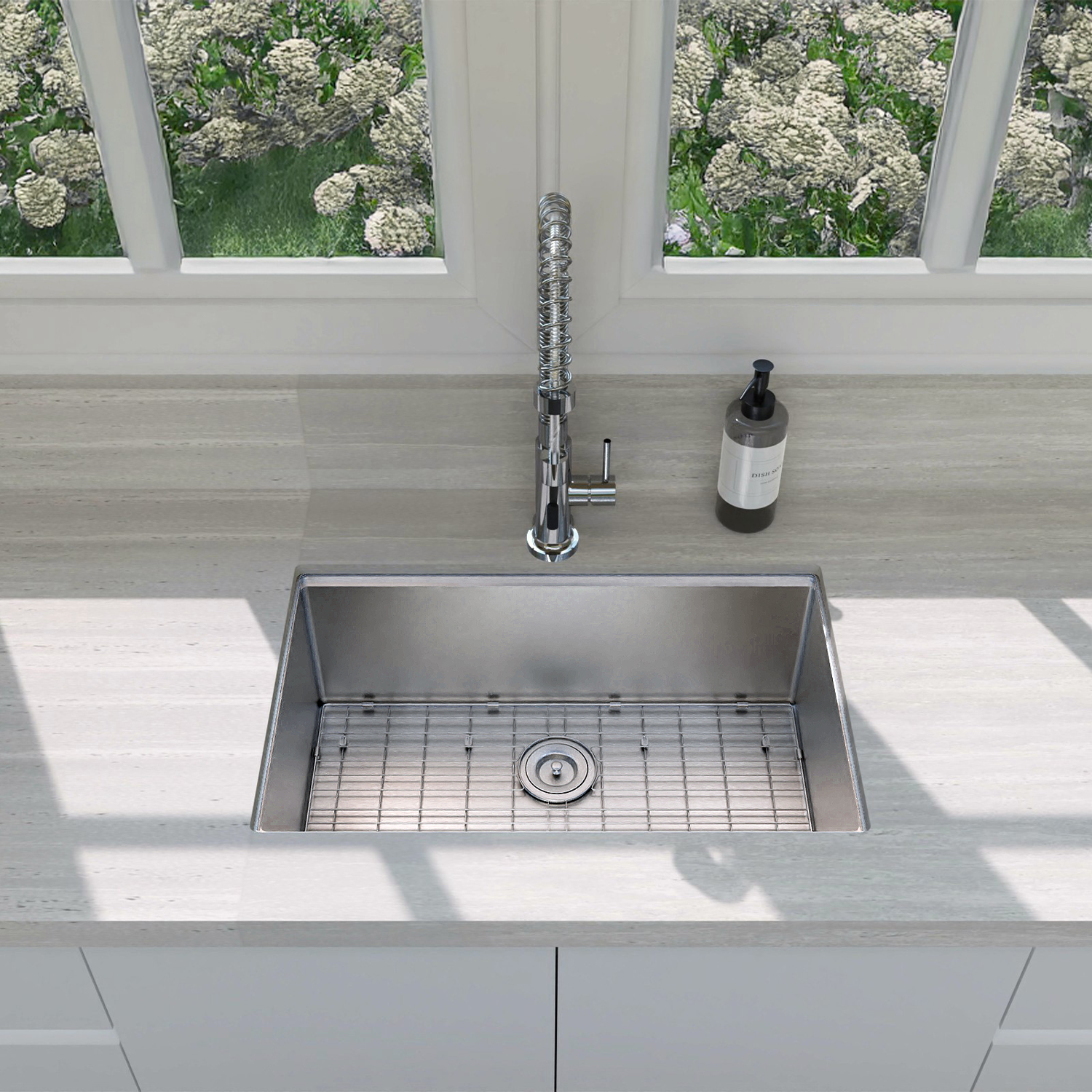 Stainless steel kitchen sink with faucet in a modern kitchen setting