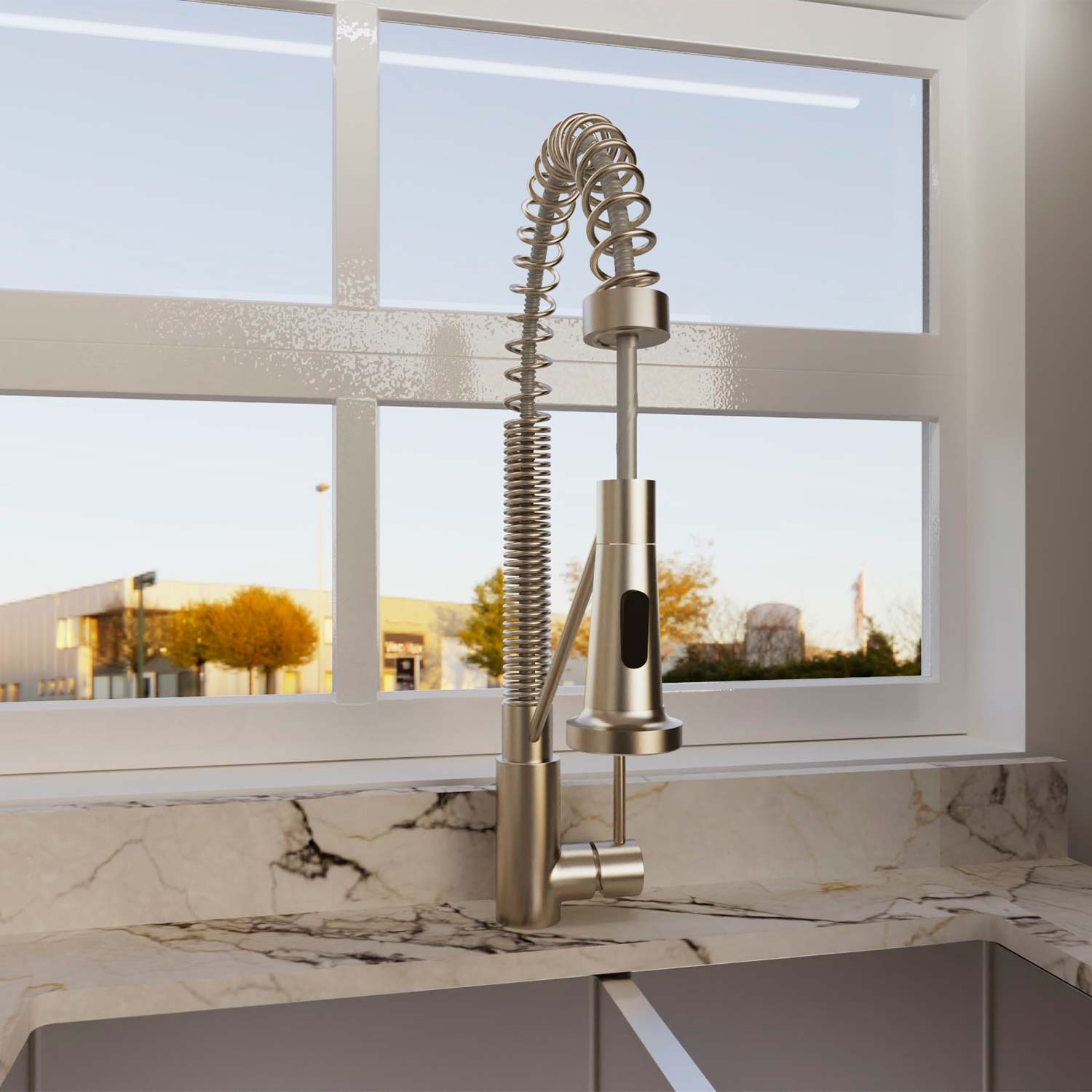 Modern kitchen faucet on a marble countertop with a window view