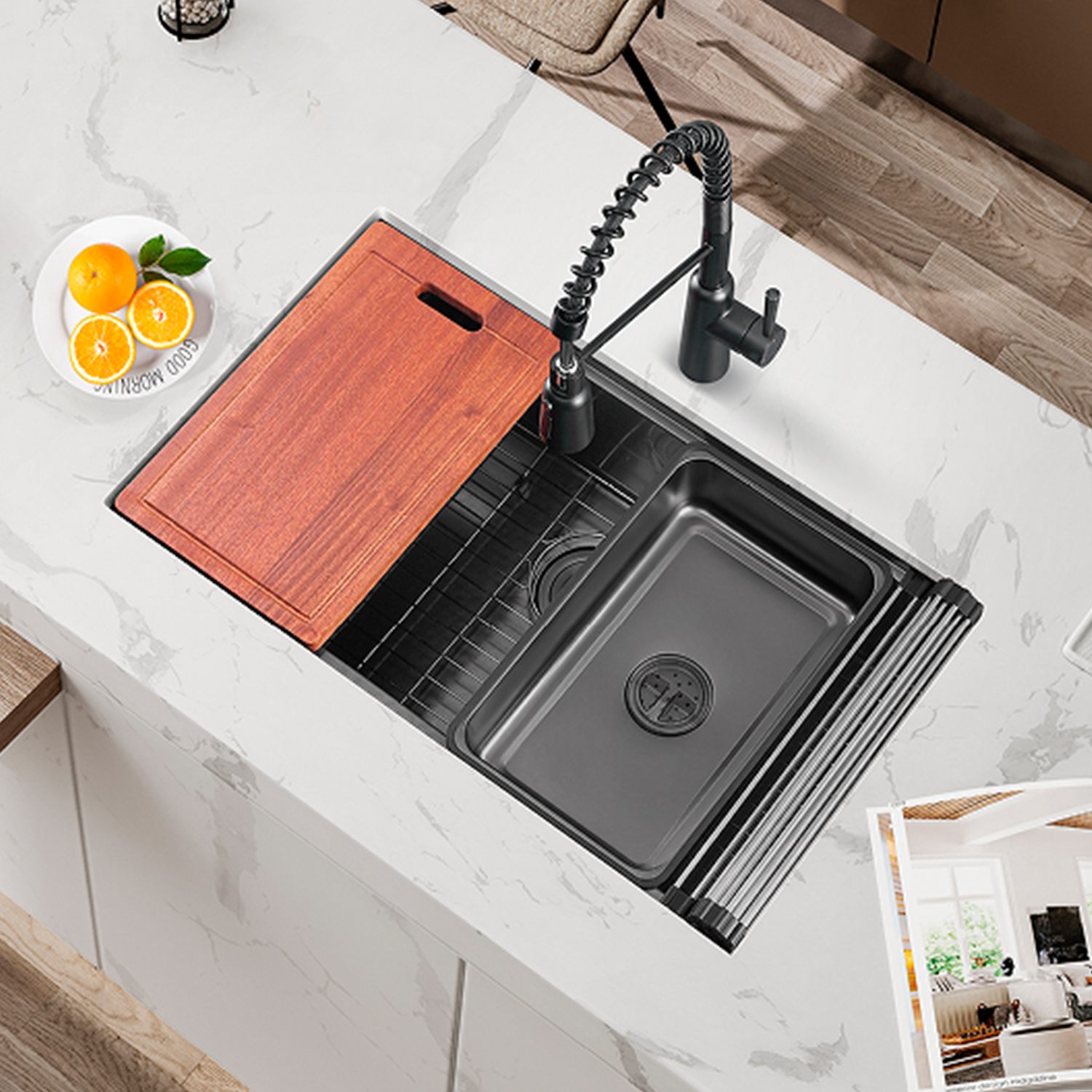 Modern kitchen sink with black faucet and wooden cutting board on a marble countertop.